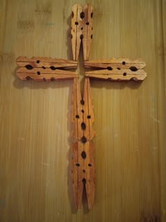 a wooden cross with holes in the middle