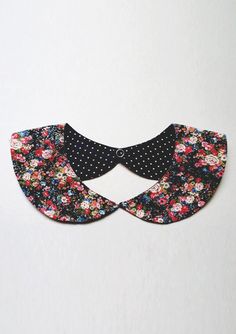 a black and white collar with flowers on it