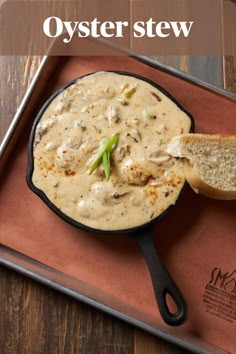 a skillet with some bread on it and the words oyster stew in front of it