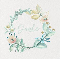 watercolor floral wreath with the word danke painted on it