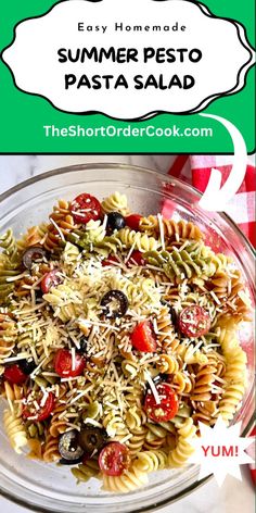 a bowl full of pasta with tomatoes, olives and parmesan cheese on top