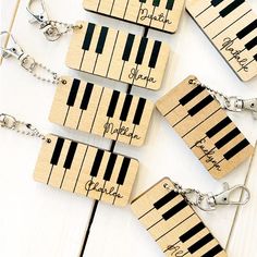 wooden key chains with piano keys engraved on them