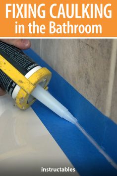 a person holding a yellow and black toothbrush with the words fixing caulking in the bathroom