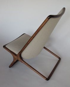 a chair that is made out of wood and fabric