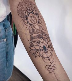 a woman with a tattoo on her arm