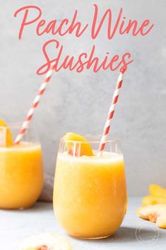 two glasses filled with peach wine slushies on top of a white countertop