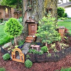 a small tree house in the middle of a garden