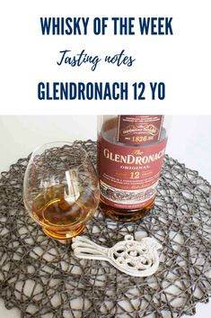 a bottle of whisky next to a glass on a doily with the words whiskey of the week tasting notes glendronach 12 yo