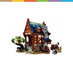 a toy house with horses and carriages in front of it on a white background,