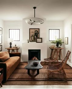 a living room filled with furniture and a fire place