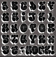 the letters are all black and white with graffiti on each letter, as well as numbers