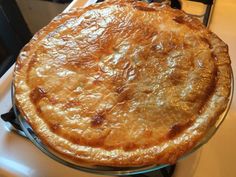 a baked pie sitting on top of a stove