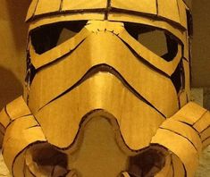 a close up of a mask made out of wood and paper with the words star wars written on it