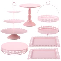 pink serving trays and cake stands with lace trim around the edges, on white background