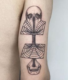 a man's arm with a tattoo on it and a skull in the middle