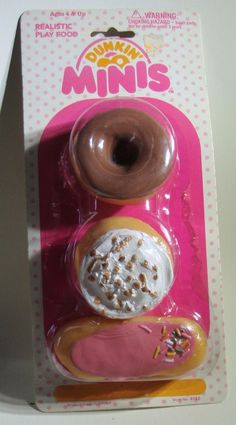 two donuts with sprinkles on them in a pink package for play doughnuts