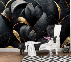 an artistic black and gold wallpaper in a living room with a chair, table and rug