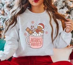 Merry and Bright Christmas gingerbread sweatshirt | Cute Christmas crewneck | Christmas drinks | Holiday sweatshirt | Retro Christmas tee .: Printed on Gildan 18000 crewneck sweatshirt .: 50% cotton, 50% polyester .: Medium-heavy fabric .: Loose fit .: Runs true to size (unisex fit) .: Made to order Retro Western Aesthetic, Grunge Sweatshirt, Cowgirl Shirts, Embroidered Gifts, Style Sweatshirt, Mama Shirts, Matching Pajamas