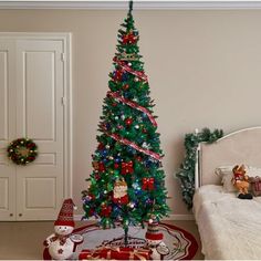 a decorated christmas tree in the corner of a bedroom