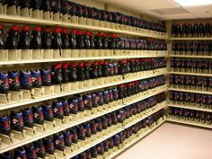 the shelves are filled with many different kinds of hats and gloves on display in this room