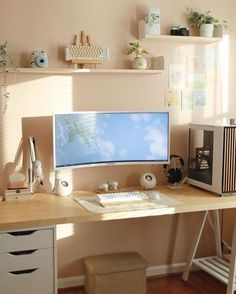 a desktop computer sitting on top of a wooden desk