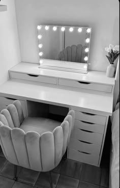 a white desk with a chair and a mirror