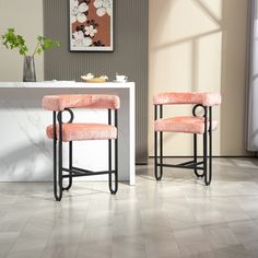 two stools sitting next to each other in a room