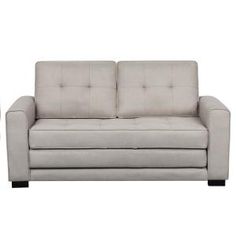 two white couches sitting next to each other