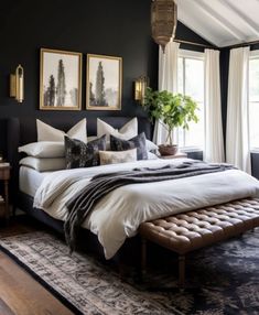 a bedroom with black walls, white bedding and pillows on top of the bed