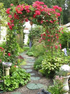 a garden with lots of flowers and plants around it