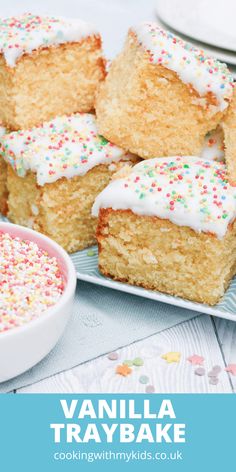 vanilla tray bakes with white frosting and sprinkles