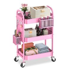 a pink cart filled with lots of items