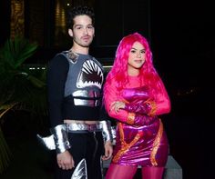 a man and woman dressed up in costumes