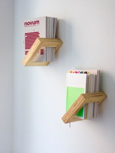 two wooden shelves holding books on the wall