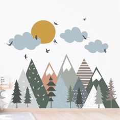 a wall decal with trees, mountains and birds flying in the sky above it