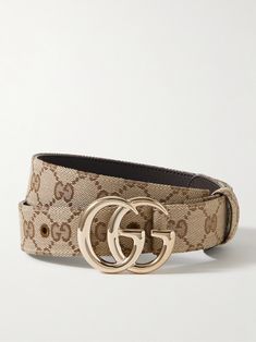 Gucci's 'Marmont' belt features two versions of the house's signature motif - the interlocking one is printed on the coated-canvas, while the gleaming 'GG' functions as its buckle. It's been made in Italy and backed in smooth leather. Gucci Elastic Belt, Gucci Belt Vintage, Red Gucci Belt, Gucci Web Belt, Denim Flats, Canvas Belt, Gucci Horsebit, Gucci Gg Marmont, Print Coat