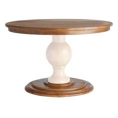 a round wooden table with two white pedestals on each side and an oval wood top