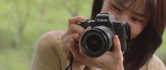 a woman taking a photo with her camera