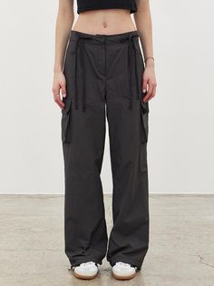 Loose-fit cargo pants in cotton fabric. Two drawstrings and covered elastic at waistband and zip fly with button. Side pockets and leg pockets with flap. Covered elastic at hems.- Low waist- Loose fit- Cargo Utility Workwear Pants With Drawstring, Utility Pants With Drawstring For Workwear, Utility Drawstring Pants For Workwear, Utility Cargo Pants With Drawstring For Workwear, Utility Parachute Pants With Functional Drawstring, Cargo Pants, Shirt Blouses, Ribbon, Loose Fitting