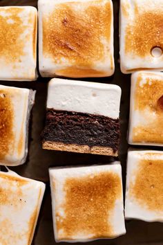 brownies and marshmallows are arranged on a baking sheet