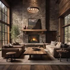 a living room filled with furniture and a fire place in the middle of a room