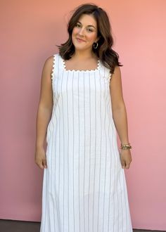 Get ready for summer with our Sea Worthy Linen Midi Dress! Effortlessly stylish with stripes and ric rac trim, this lightweight dress is perfect for vacations and beach days. Sun, sand, and style all in one piece! True to size Piper is wearing large Color: White with black pin stripes Stripe print square neck sleeveless midi dress featuring ric rac trim. Pocket at sides. Lined. Woven. Non-sheer. Lightweight. Fabric: 55%COTTON 35%LINEN 10%POLYESTER Fabric has no stretch Pull on design Casual Beach Dress With Striped Hem, Striped Lined Beach Dresses, Vacation Linen Dress With Lace Trim, Striped Beachwear Dresses For Day Out, Summer Beach Dresses With Vertical Stripes, Summer White Dress With Vertical Stripes, Striped Linen Beach Dress, Striped Linen Dresses For Vacation, Striped Linen Dress For The Beach