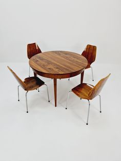 a round table with four chairs around it