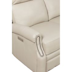 the back end of a white leather reclining couch with chain trimming on it