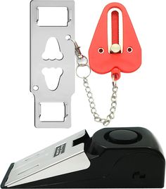 a stapler with a chain attached to it and a piece of metal on the side