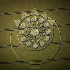 an artistic drawing on the side of a building with lots of circles and stars in it