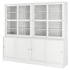 a white bookcase with glass doors and shelves on the front, against a white background