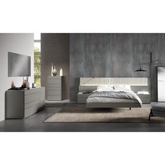 a modern bedroom with grey walls and white furniture