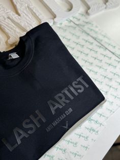 Unleash your inner lash artist with the ANTI MASCARA CLUB CREW NECK! Designed by a lash artist for lash artists, this crew neck combines sleek style with the perfect balance of comfort and cuteness. Available in black, white, and tan, it's the perfect addition to your lashing attire. Get ready to elevate your lash game! Lash Room Picture Wall, All Black Salon, Black And White Lash Room, Fashion Esthetics, Dark Esthetician Room, Lash Merch, Small Esthetician Room Ideas, Lash Highlights, Lash Artist Aesthetic