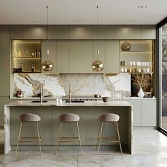 a kitchen with marble counter tops and stools next to an open glass doored window